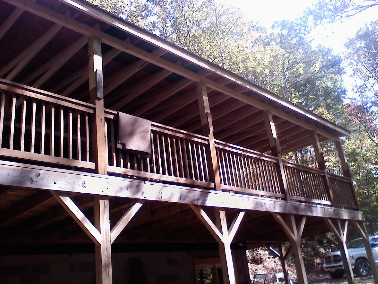 Timber framing under a new elevated porch and deck — Roof Leak Repair in Tahlequah by Roofing Brothers